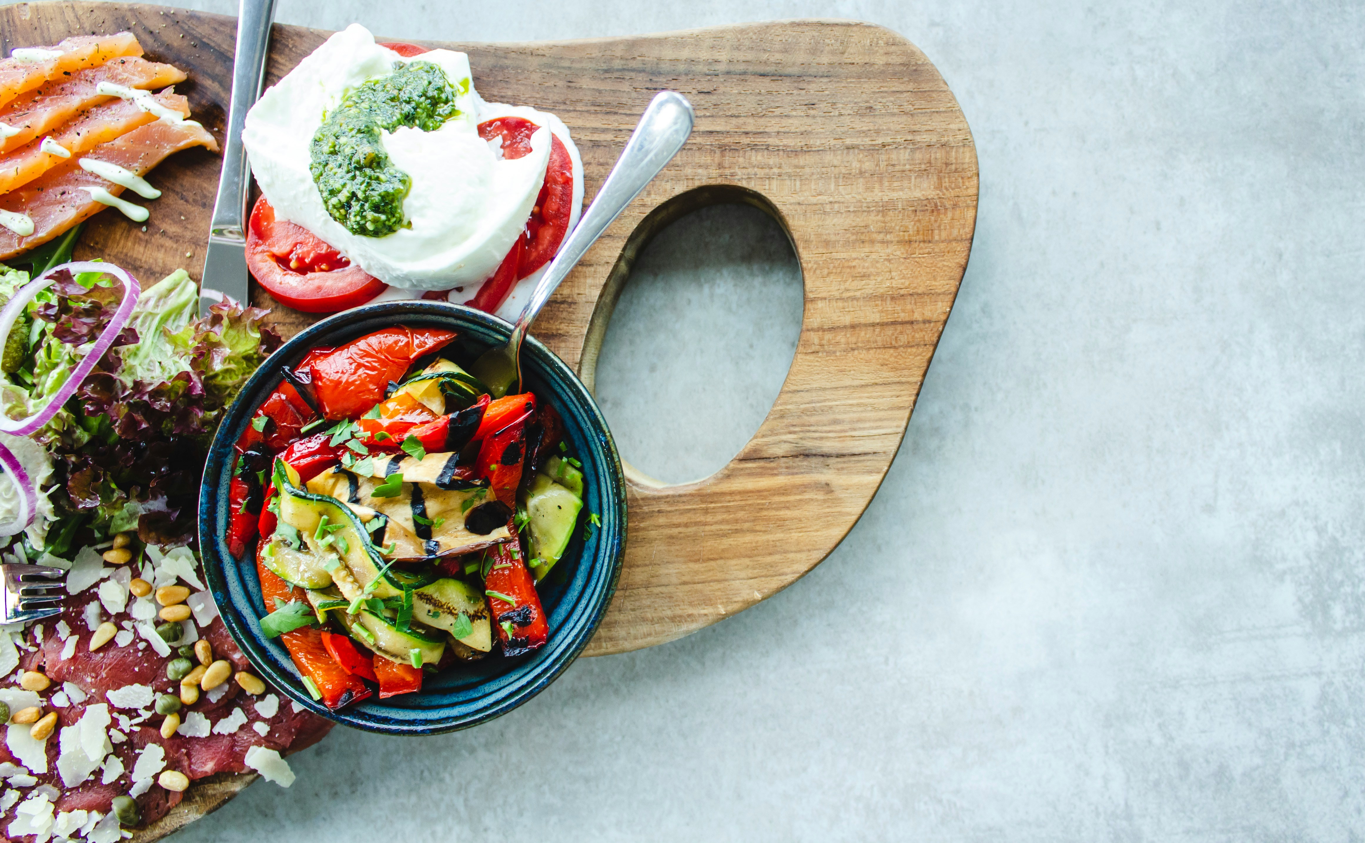 Cutting board with a variety of Mediterranean foods